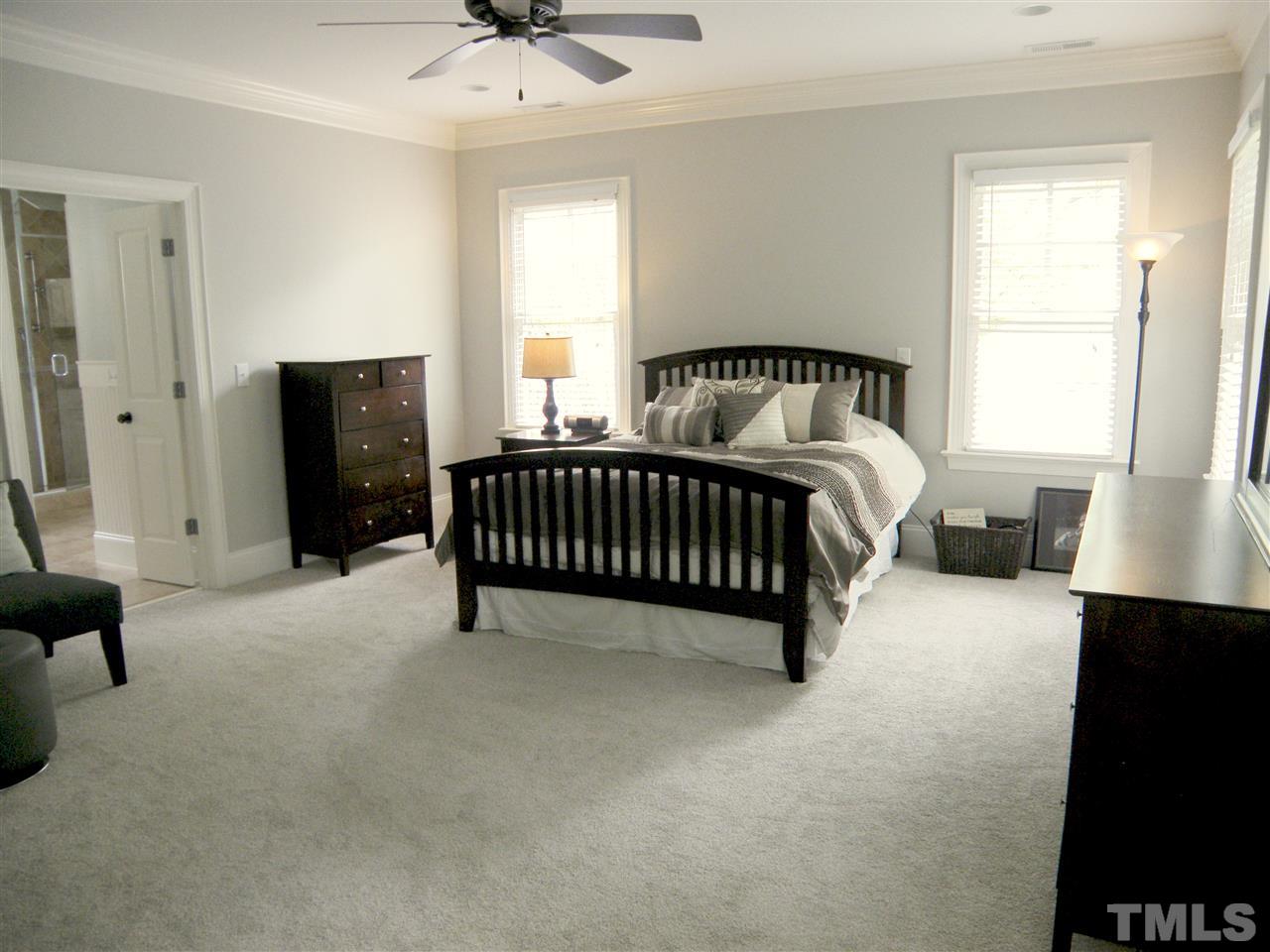 2702 Bedford Avenue Raleigh, NC 27607 - Photo 16 of 25 a bed sitting in a bedroom next to a window