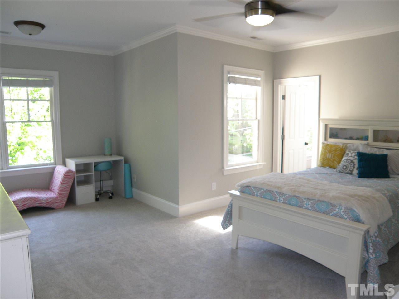2702 Bedford Avenue Raleigh, NC 27607 - Photo 20 of 25 a bedroom with a bed and a window
