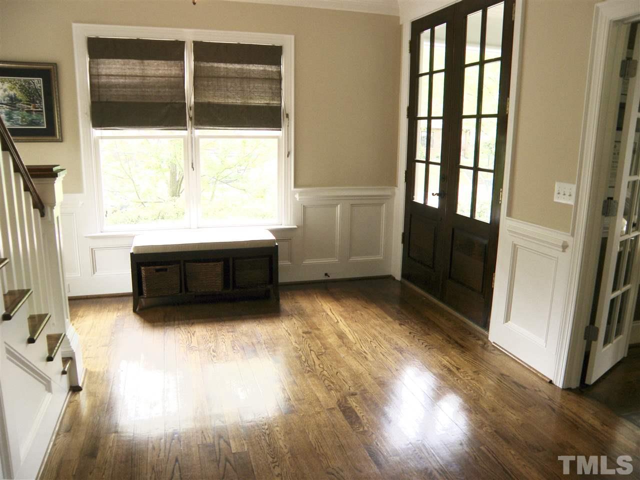 2702 Bedford Avenue Raleigh, NC 27607 - Photo 3 of 25 wooden floor in an empty room with a window