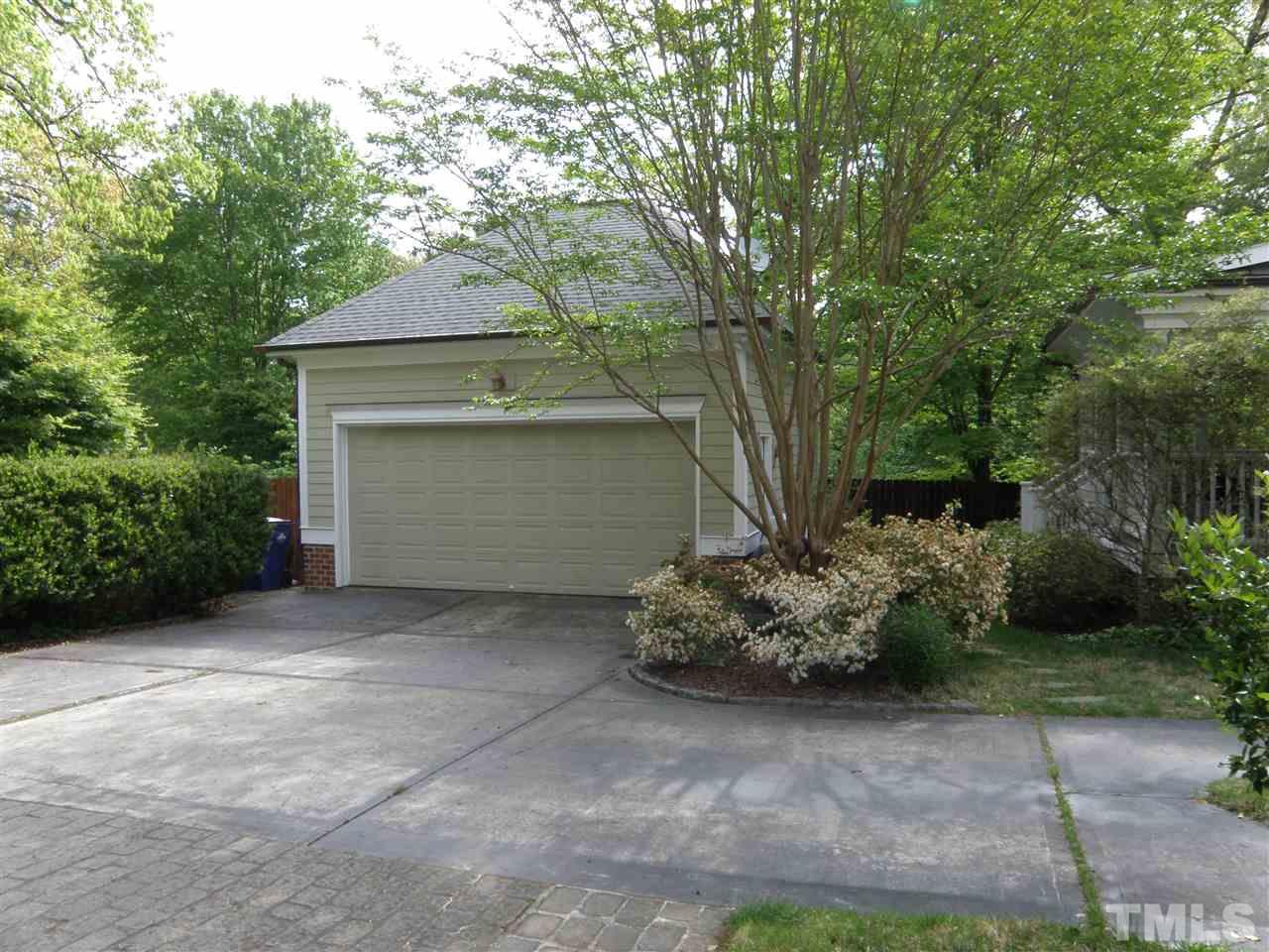 2702 Bedford Avenue Raleigh, NC 27607 - Photo 24 of 25 a front view of a house with a yard
