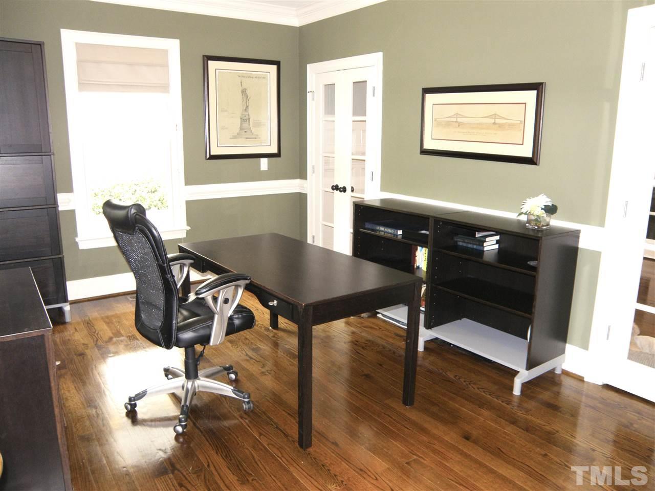 2702 Bedford Avenue Raleigh, NC 27607 - Photo 6 of 25 a view of a dining room with furniture and wooden floor