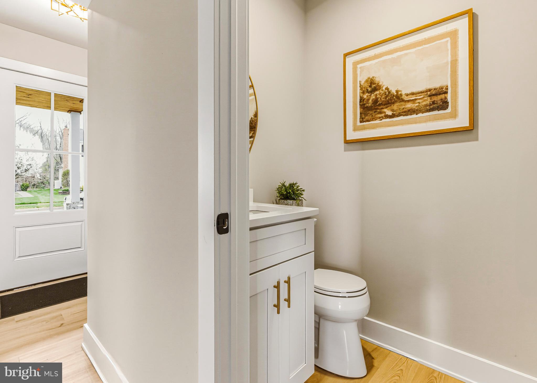 88 Freedom Road Sewell, NJ 08080 - Photo 17 of 30 a bathroom with a toilet and a painting on the wall