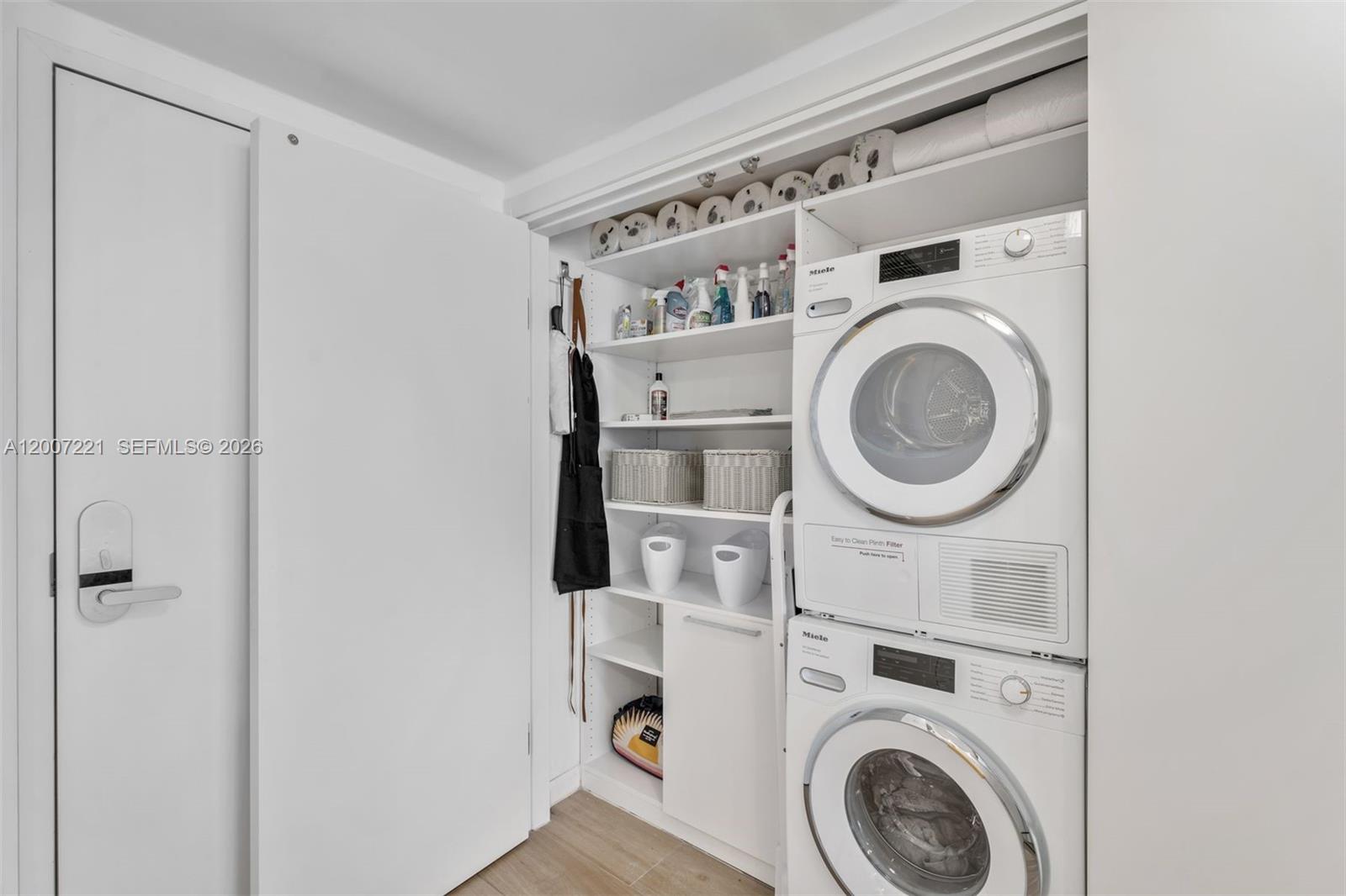 2301 Collins Avenue, Unit 902 Miami Beach, FL 33139 - Photo 12 of 22 a view of a storage & utility room with dryer and washer