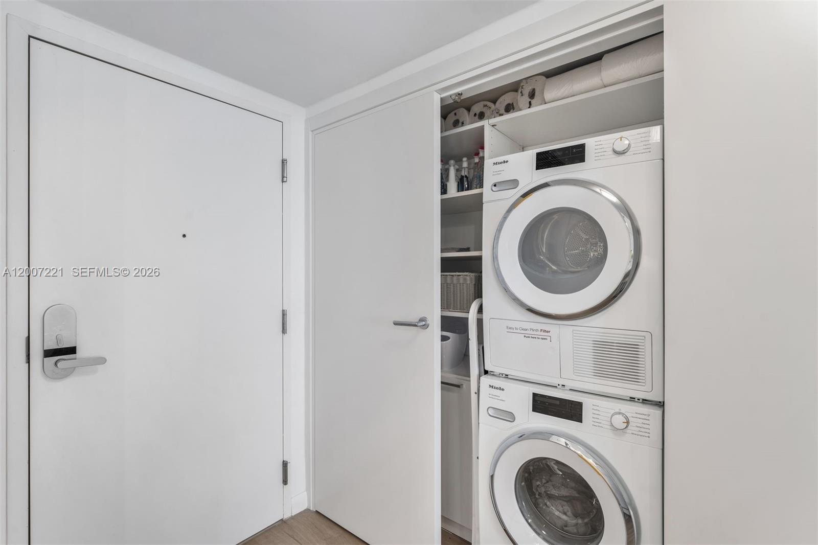 2301 Collins Avenue, Unit 902 Miami Beach, FL 33139 - Photo 13 of 22 a view of a storage & utility room with dryer and washer