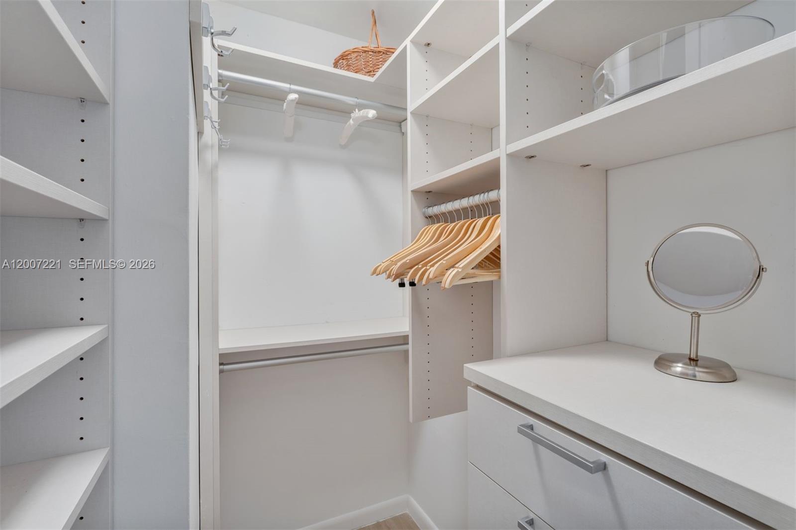 2301 Collins Avenue, Unit 902 Miami Beach, FL 33139 - Photo 21 of 22 a kitchen with a sink and a mirror