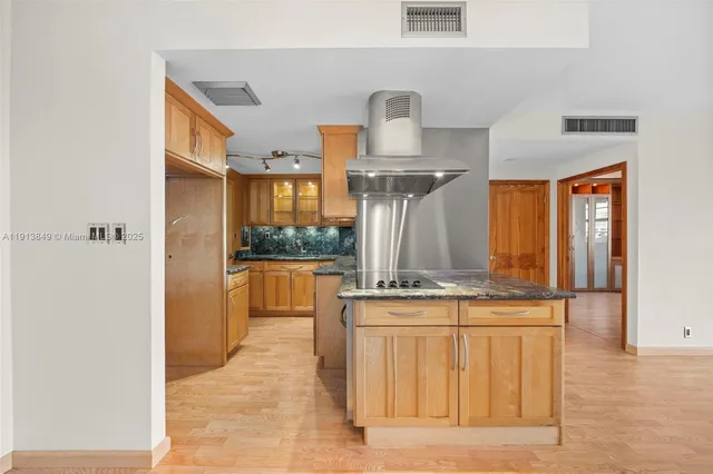 a kitchen with a sink and a refrigerator