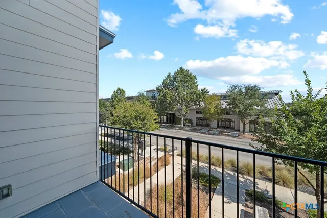a view of a chair and table in the patio