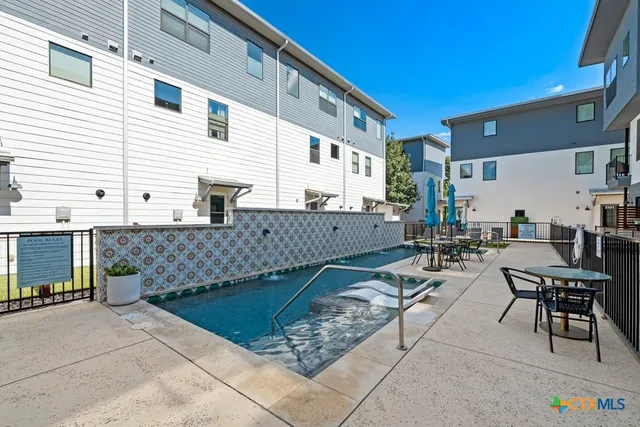a kitchen with stainless steel appliances granite countertop a sink and a stove