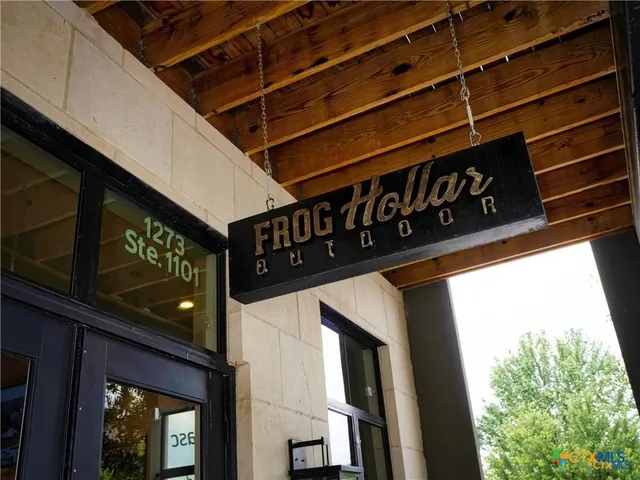 a view of a house with a door and balcony