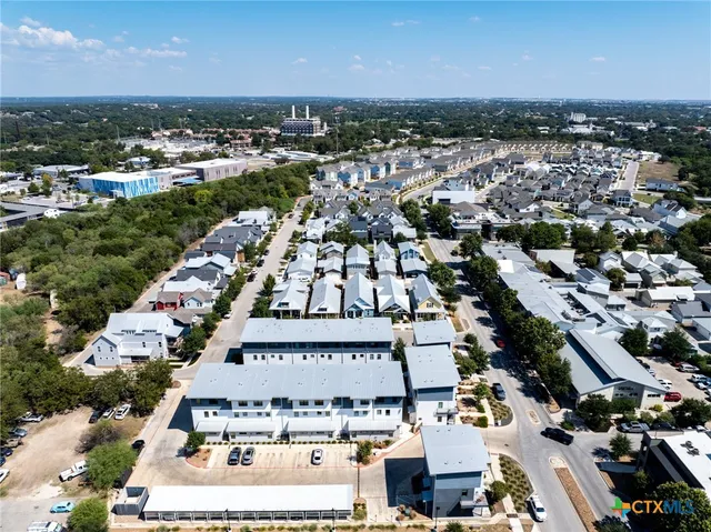 an aerial view of a city with lots of residential buildings