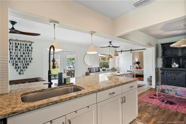 a bathroom with a sink a mirror and a shower