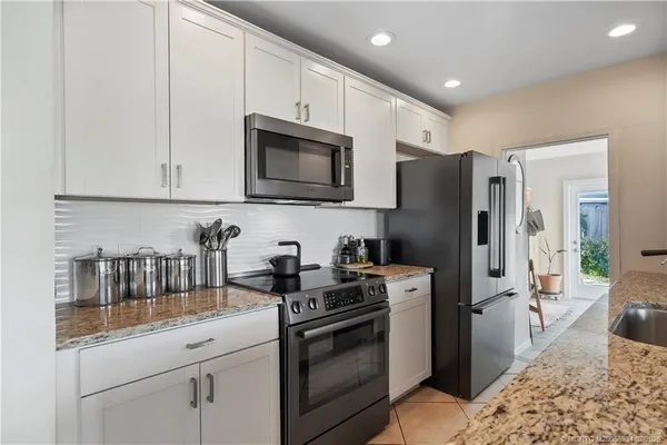 a view of a bedroom with washer and dryer
