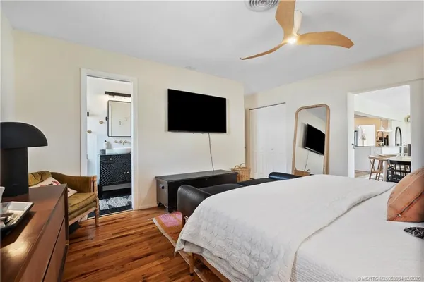 a living room with a couch and a mirror