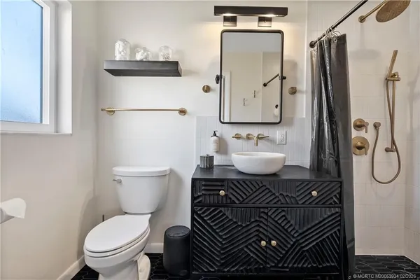 a view of house with yard and outdoor seating