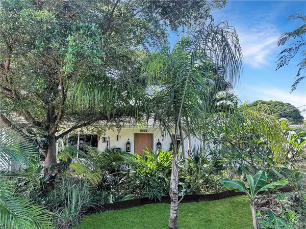 a front view of a house with outdoor seating