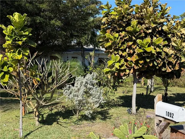 a view of a patio with a dining table and chairs with a patio