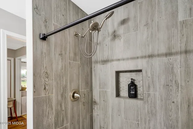 a bedroom with furniture and a window