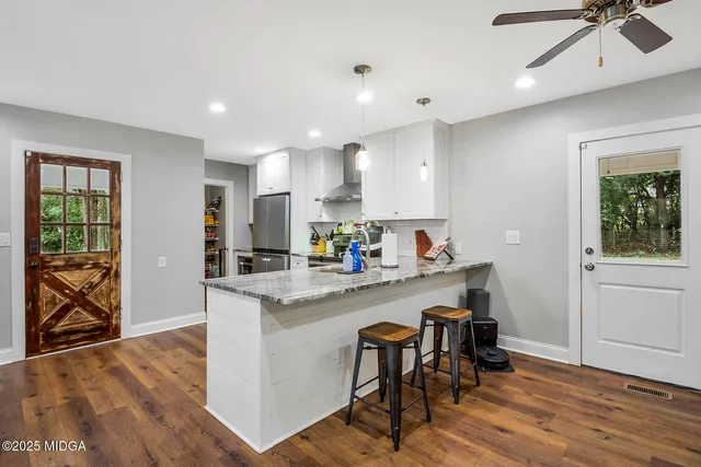 a kitchen with a stove and cabinets