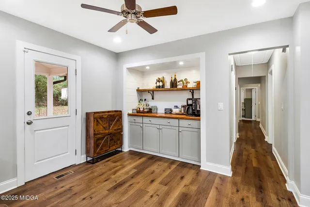 a bedroom with a bed rug and window