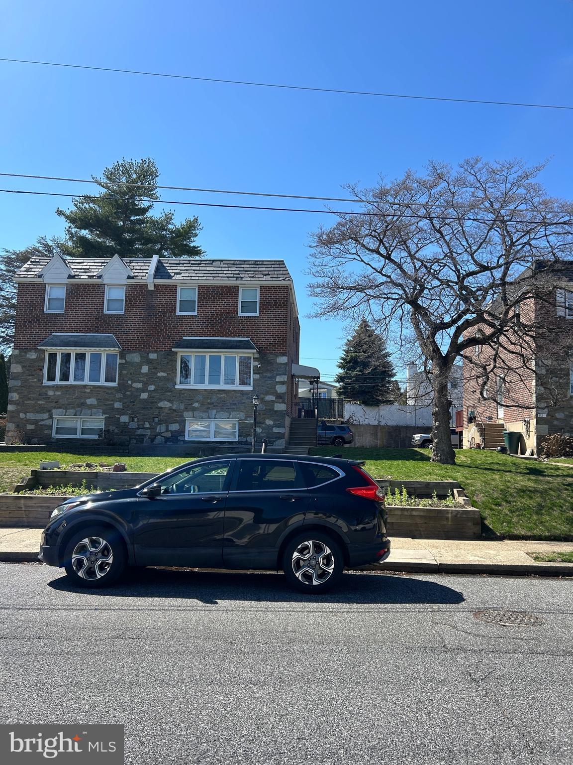 a car parked in front of a house