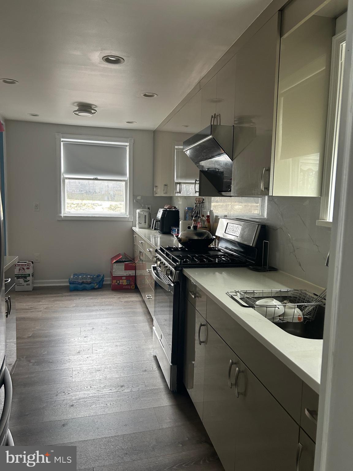 830 Pne Hl Road Philadelphia, PA 19115 - Photo 12 of 42 a kitchen with a stove a refrigerator and a window