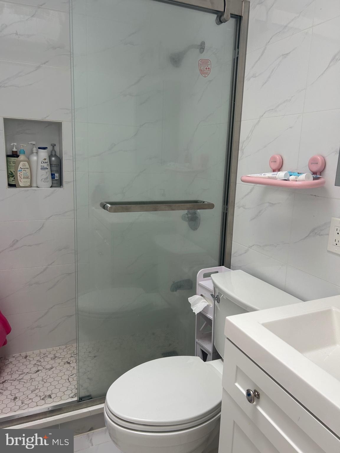 830 Pne Hl Road Philadelphia, PA 19115 - Photo 18 of 42 a white toilet sitting next to a bathroom sink