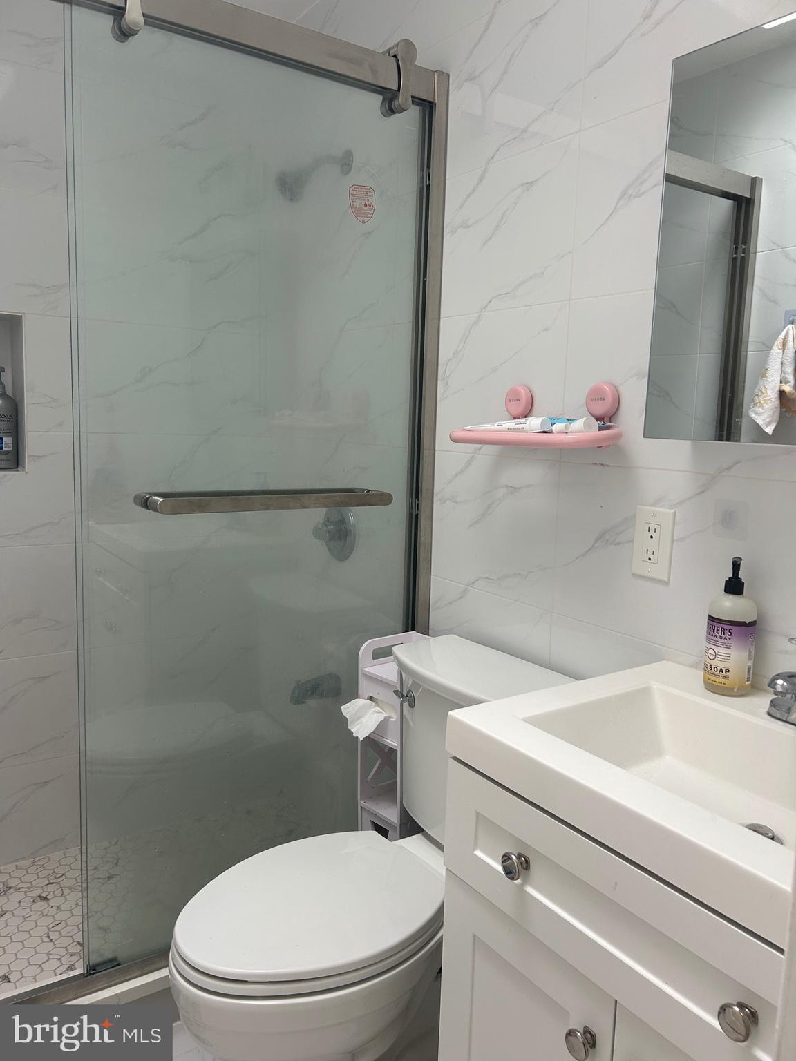 830 Pne Hl Road Philadelphia, PA 19115 - Photo 19 of 42 a bathroom with a sink a toilet and shower