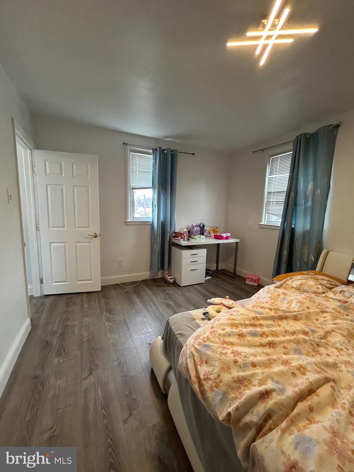 830 Pne Hl Road Philadelphia, PA 19115 - Photo 24 of 42 a bedroom with a bed and wooden floor