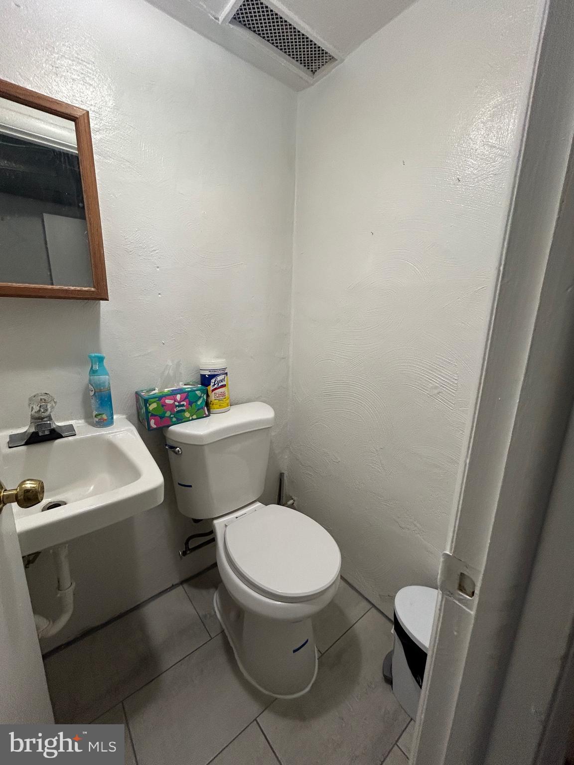 830 Pne Hl Road Philadelphia, PA 19115 - Photo 32 of 42 a white toilet sitting next to a bathroom sink