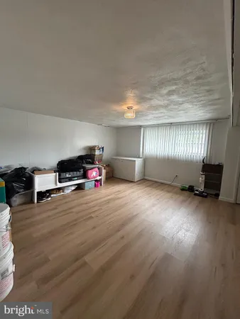 a room with a bed and furniture