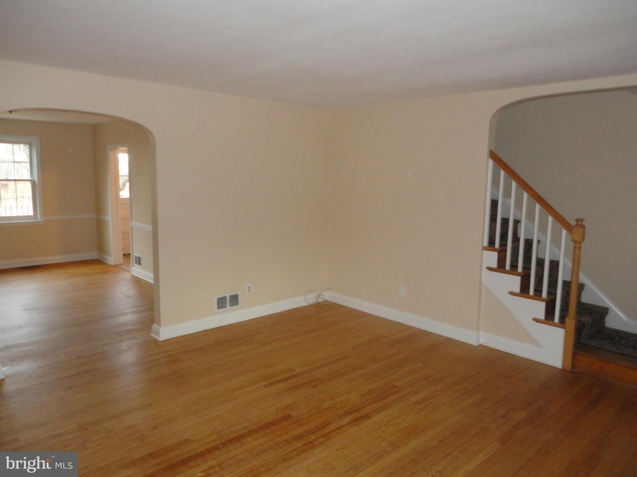 224 Stanmore Road Baltimore, MD 21212 - Photo 6 of 19 a view of a hallway with wooden floor