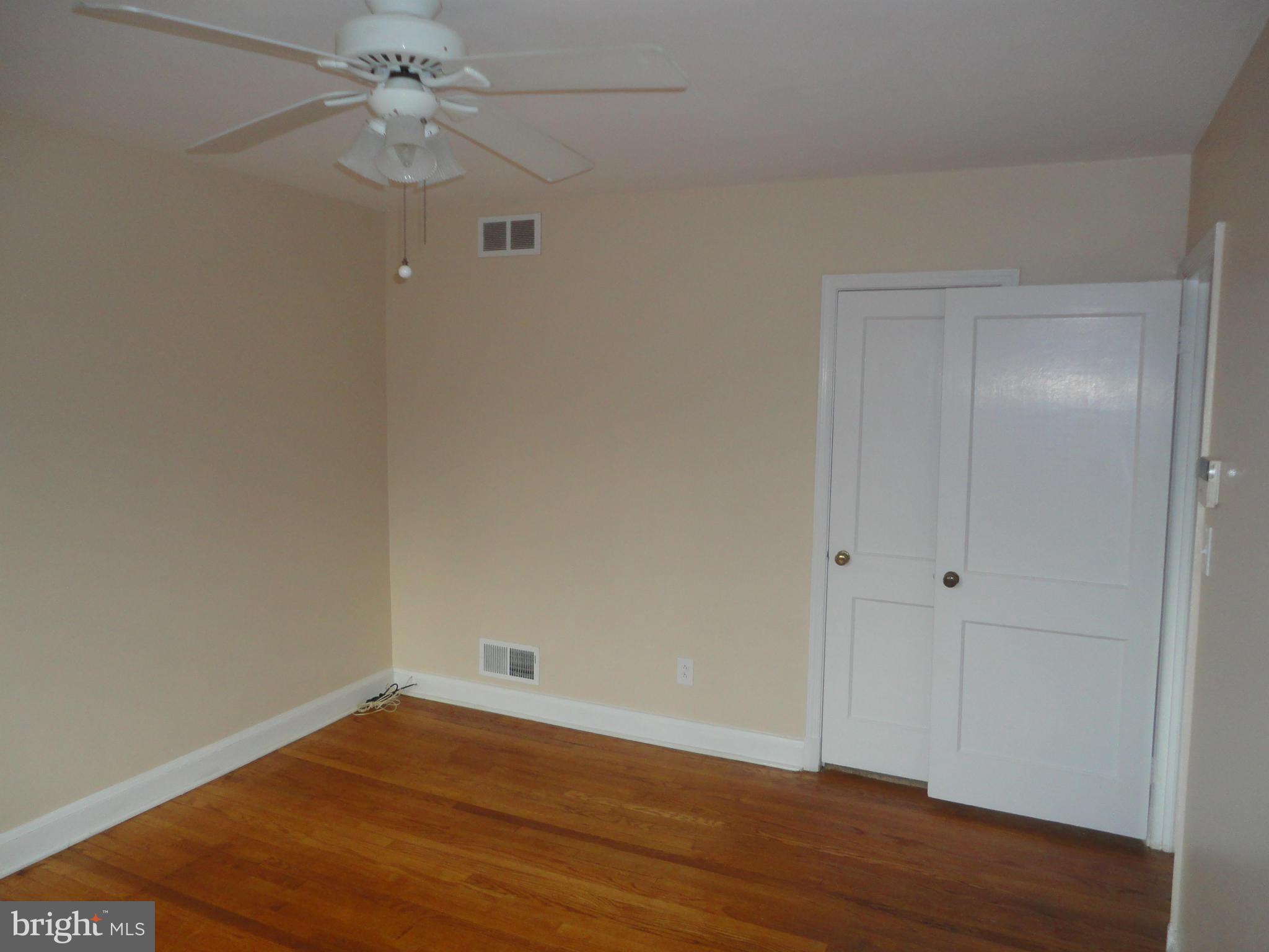 224 Stanmore Road Baltimore, MD 21212 - Photo 10 of 19 a view of an empty room with wooden floor