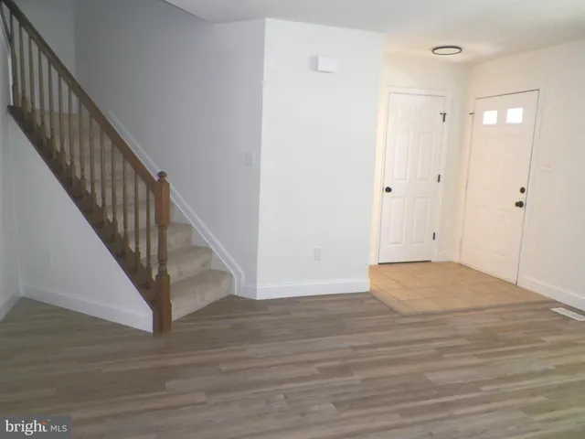 a kitchen with cabinets stainless steel appliances and a sink