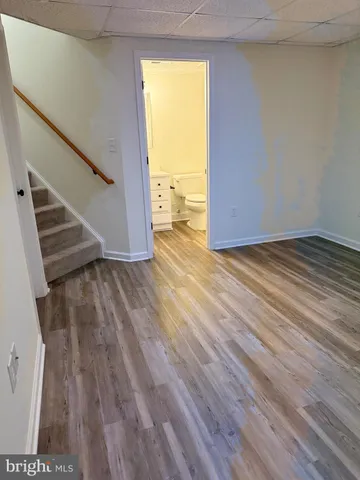 a view of an empty room and glass door