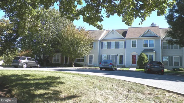 a front view of building with yard