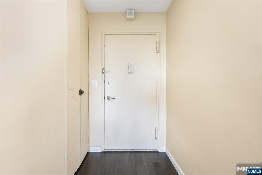 2000 Linwood Avenue, Unit 5L Fort Lee, NJ 07024 - Photo 6 of 26 a view of a hallway with wooden floor