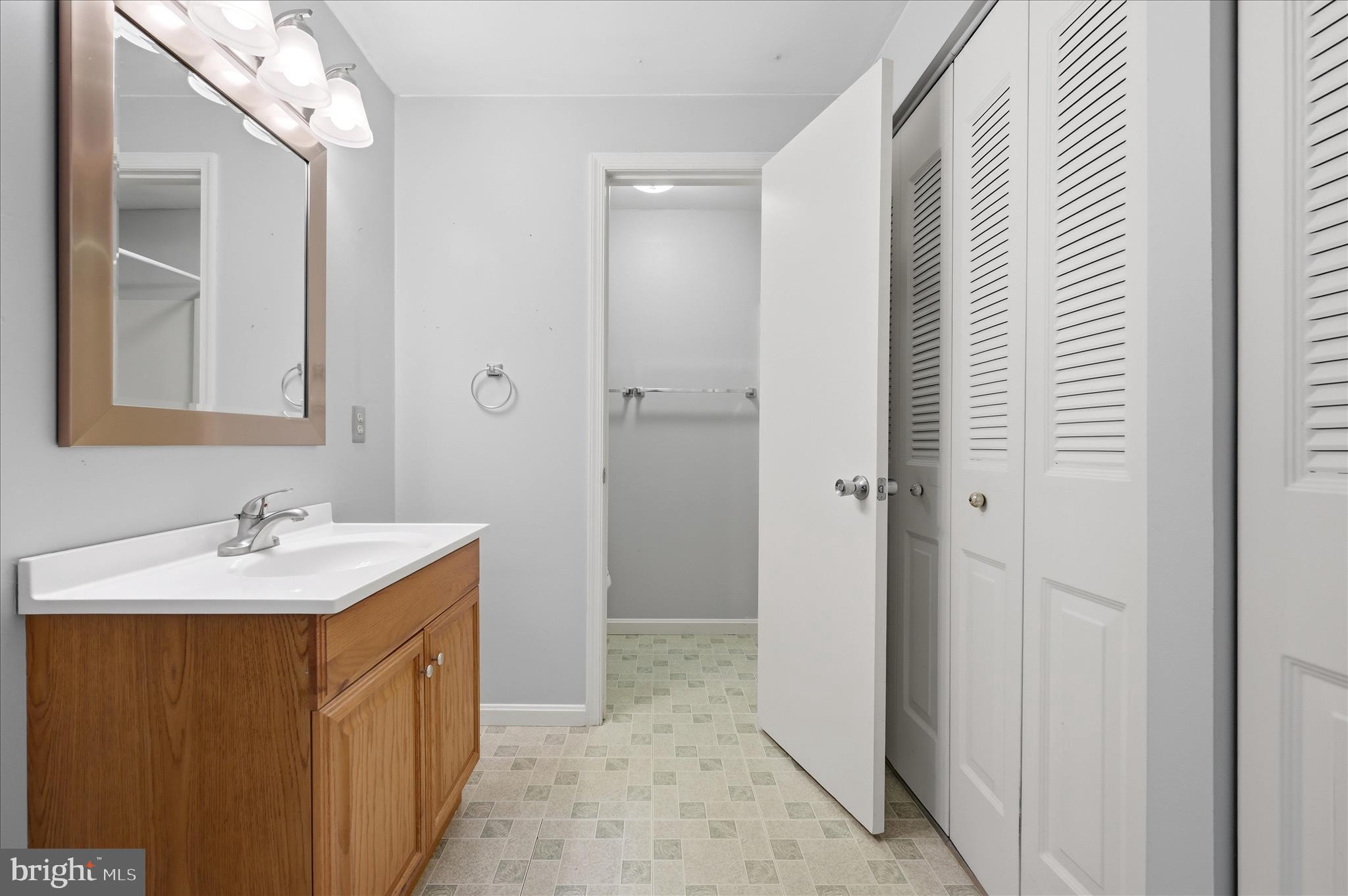 244 High Banks Road Stephenson, VA 22656 - Photo 24 of 45 a bathroom with a sink a mirror and a shower