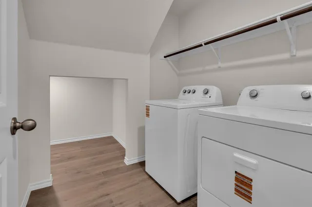 a view of storage and utility room with washer and dryer