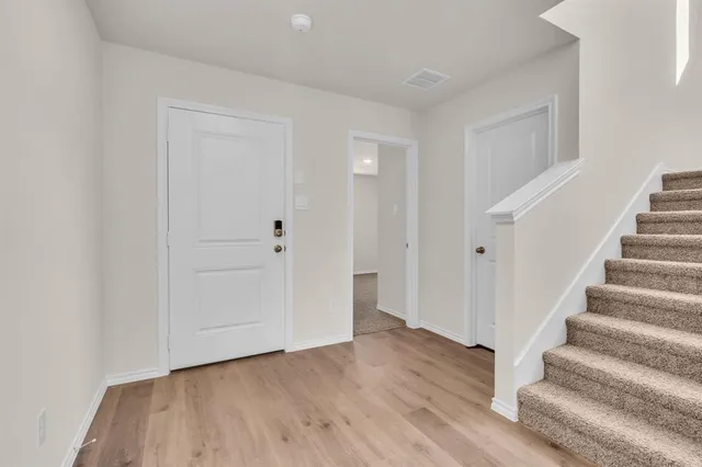 a view of entryway with wooden floor