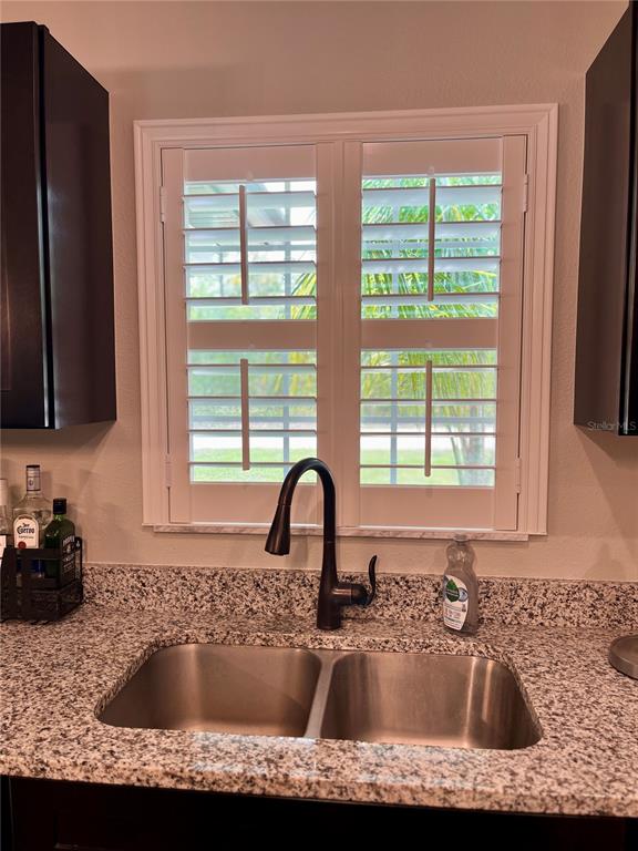 13486 English Sparrow Road Weeki Wachee, FL 34614 - Photo 13 of 51 a kitchen sink with a window