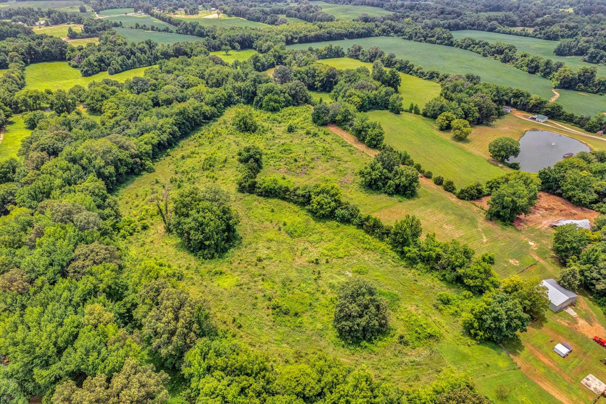 0 Holly Grove Road Covington, TN 38019 - Photo 3 of 11 an aerial view of residential houses with outdoor space and trees