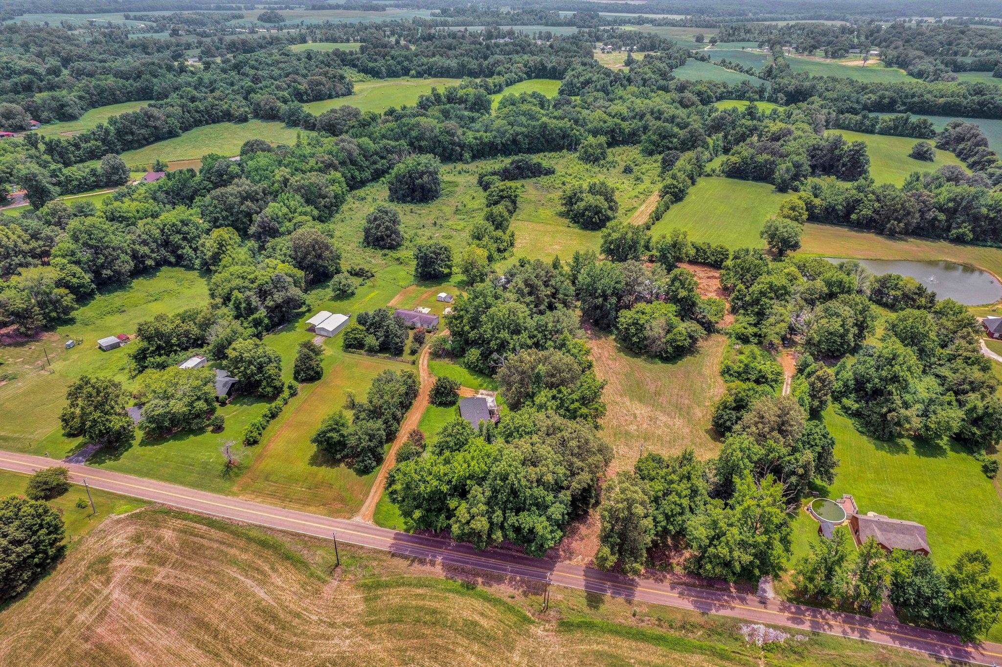 0 Holly Grove Road Covington, TN 38019 - Photo 6 of 11 an aerial view of residential houses with outdoor space and trees