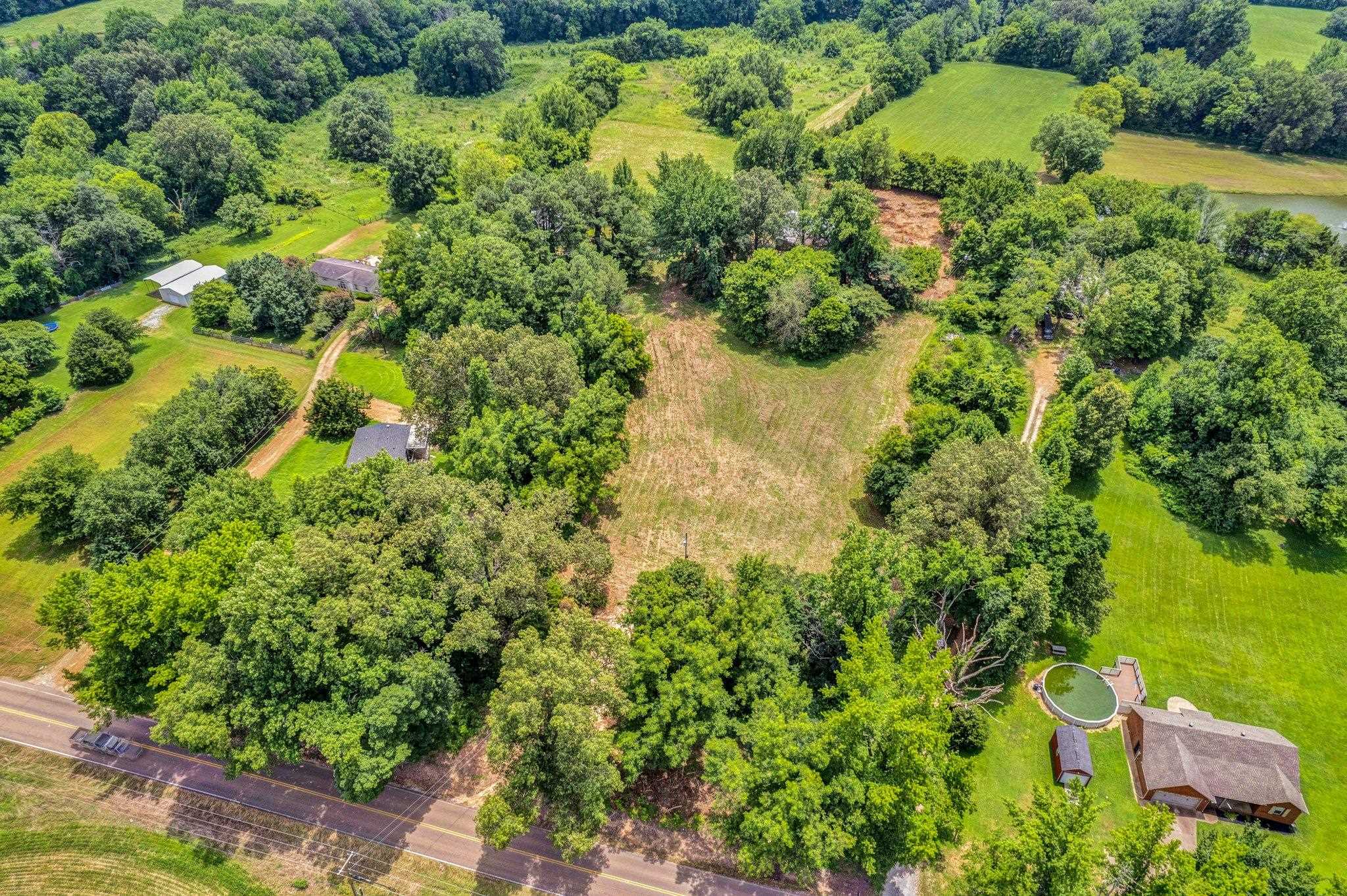 0 Holly Grove Road Covington, TN 38019 - Photo 7 of 11 an aerial view of residential house with outdoor space and trees all around
