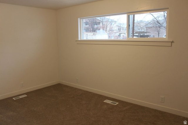 545 100 East Bountiful, UT 84010 - Photo 6 of 17 Spare room with baseboards and dark carpet