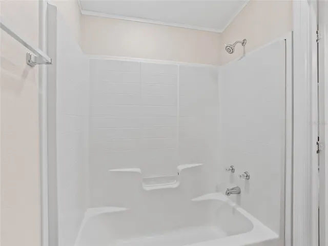 a bathroom with a white bath tub