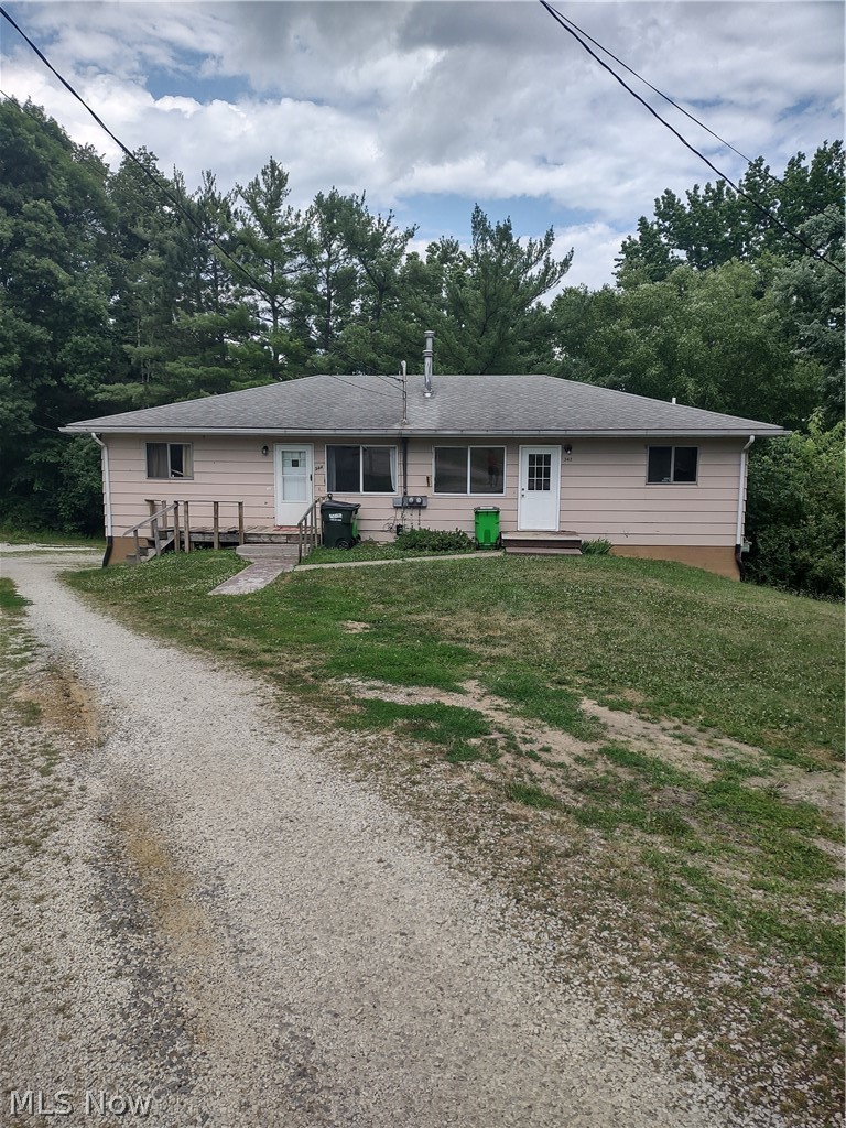 Single story home with a front yard