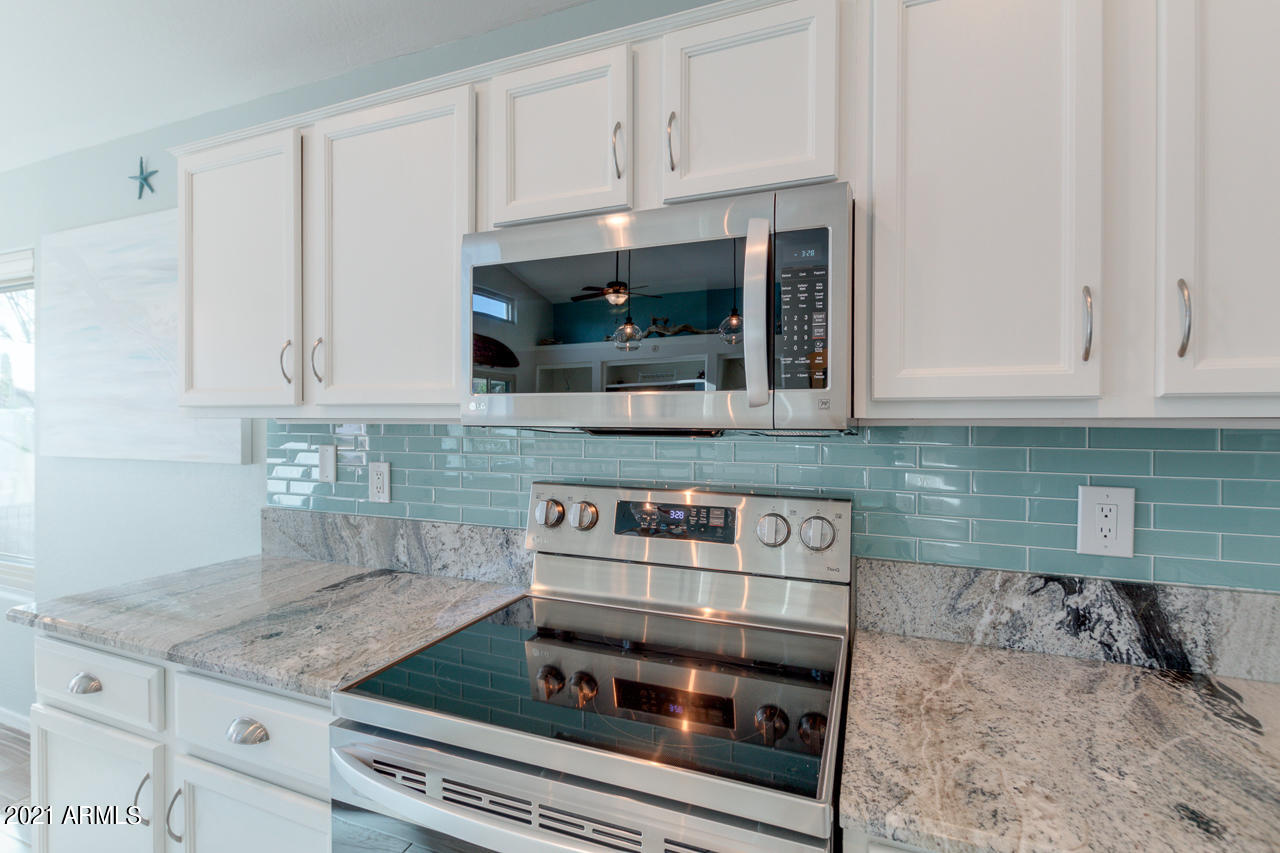 17541 West Rock Ledge Road Goodyear, AZ 85338 - Photo 17 of 62 Fabulous glass subway backsplash