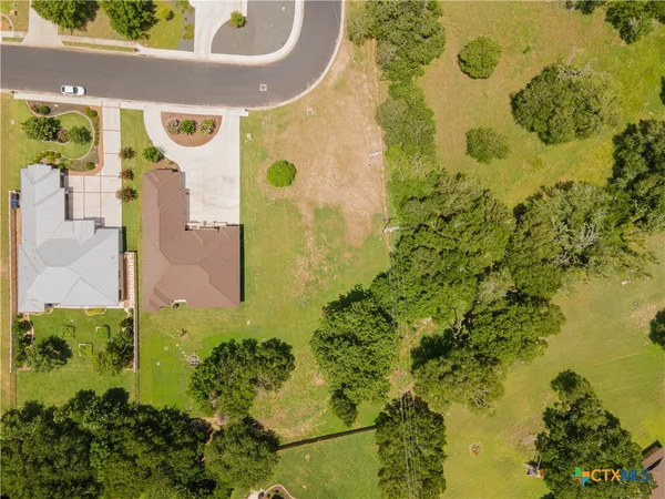 an aerial view of residential house with pool yard and outdoor seating