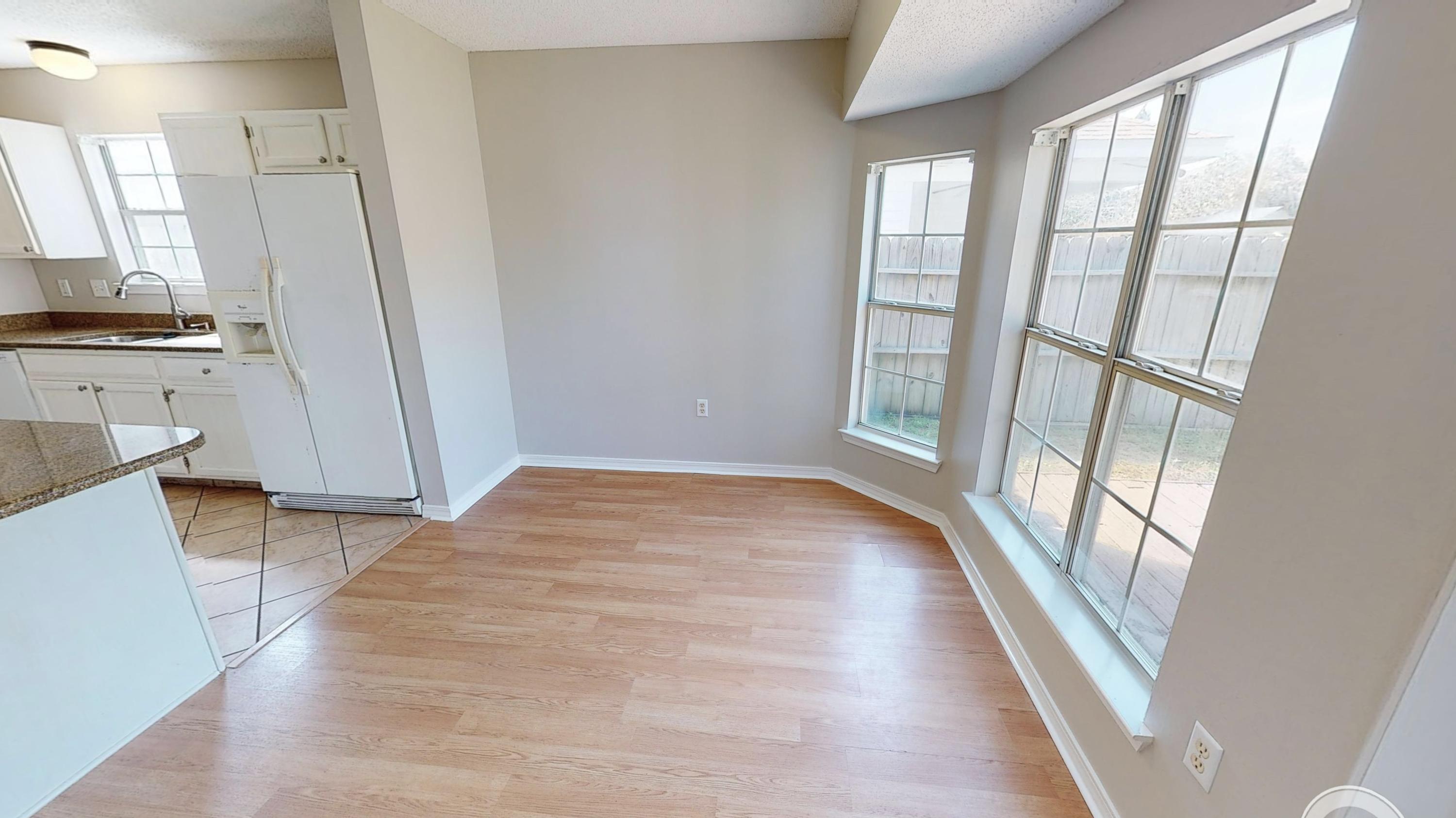 3621 Goldsbys Way Destin, FL 32541 - Photo 13 of 38 a view of an empty room with wooden floor and a window