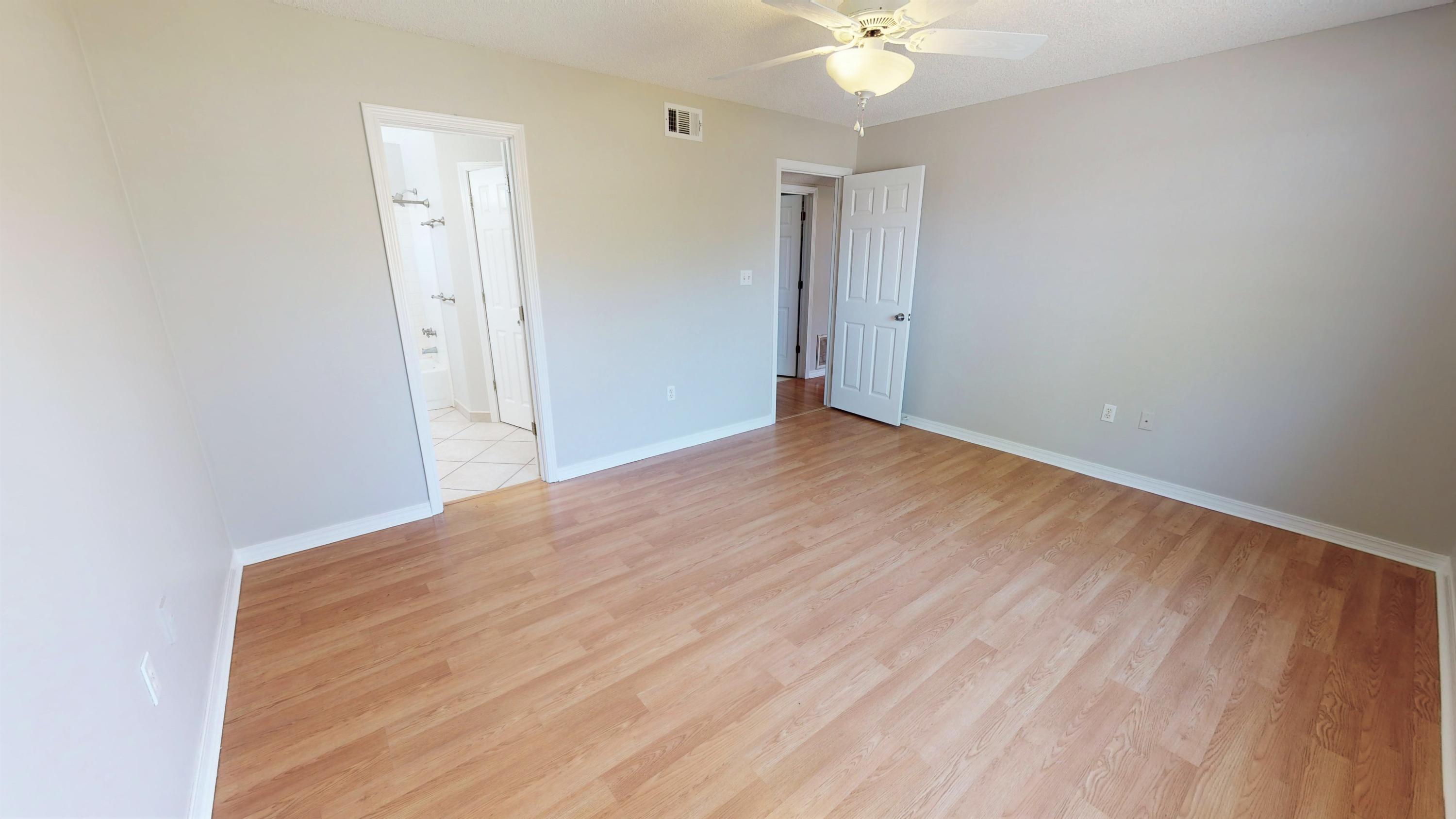 3621 Goldsbys Way Destin, FL 32541 - Photo 21 of 38 a view of a room with wooden floor and fan